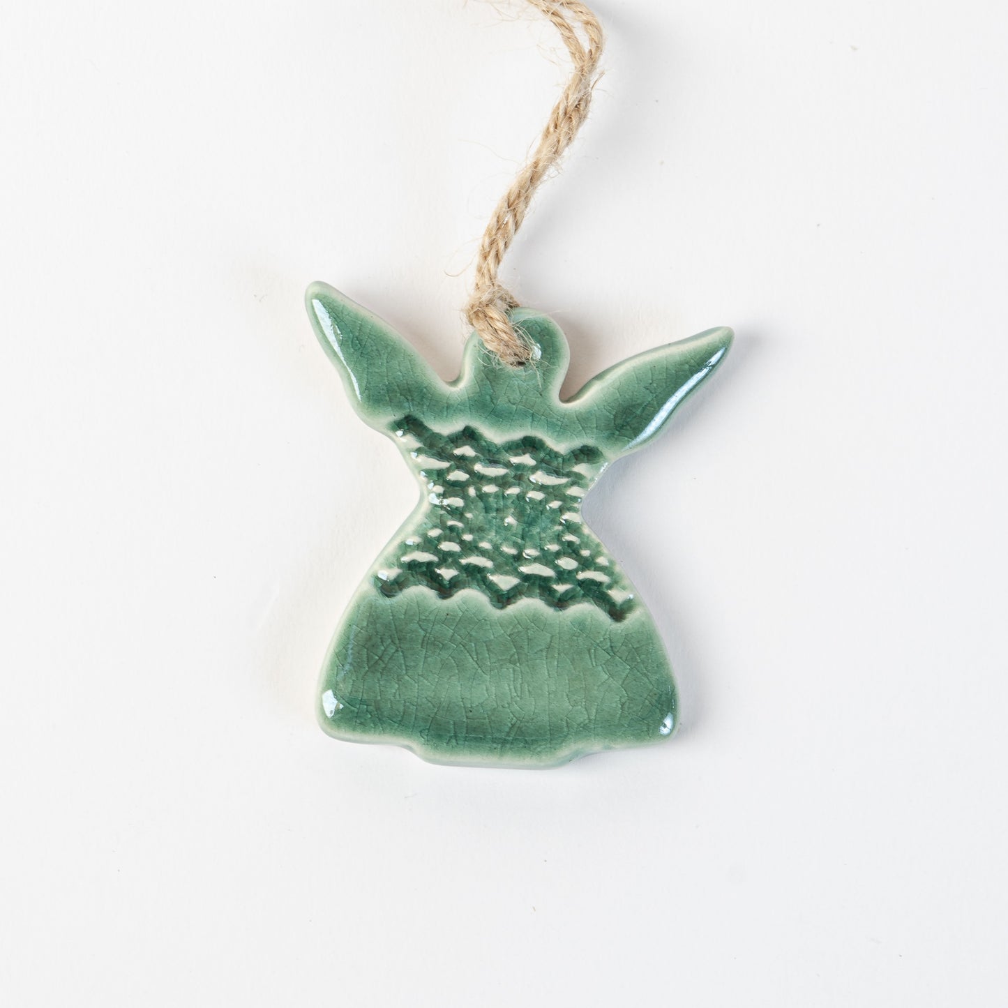 Ceramic angel in fir green ornament hanging on a white background made by the wirksworth pottery company