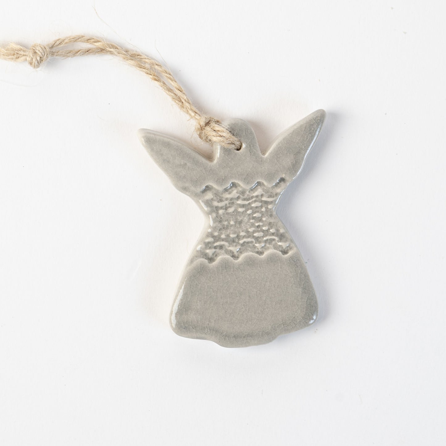 Ceramic angel in grey frost ornament hanging on a white background made by the wirksworth pottery company