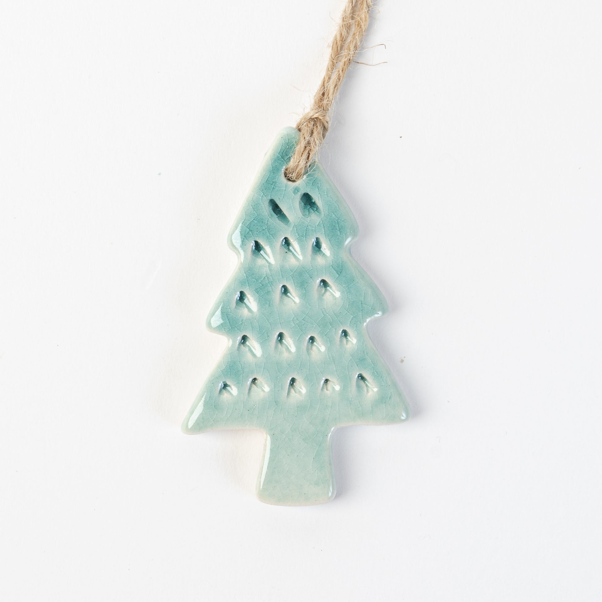 Arctic Blue textured Ceramic Christmas tree ornament on a white background handmade by the Wirksworth pottery company 