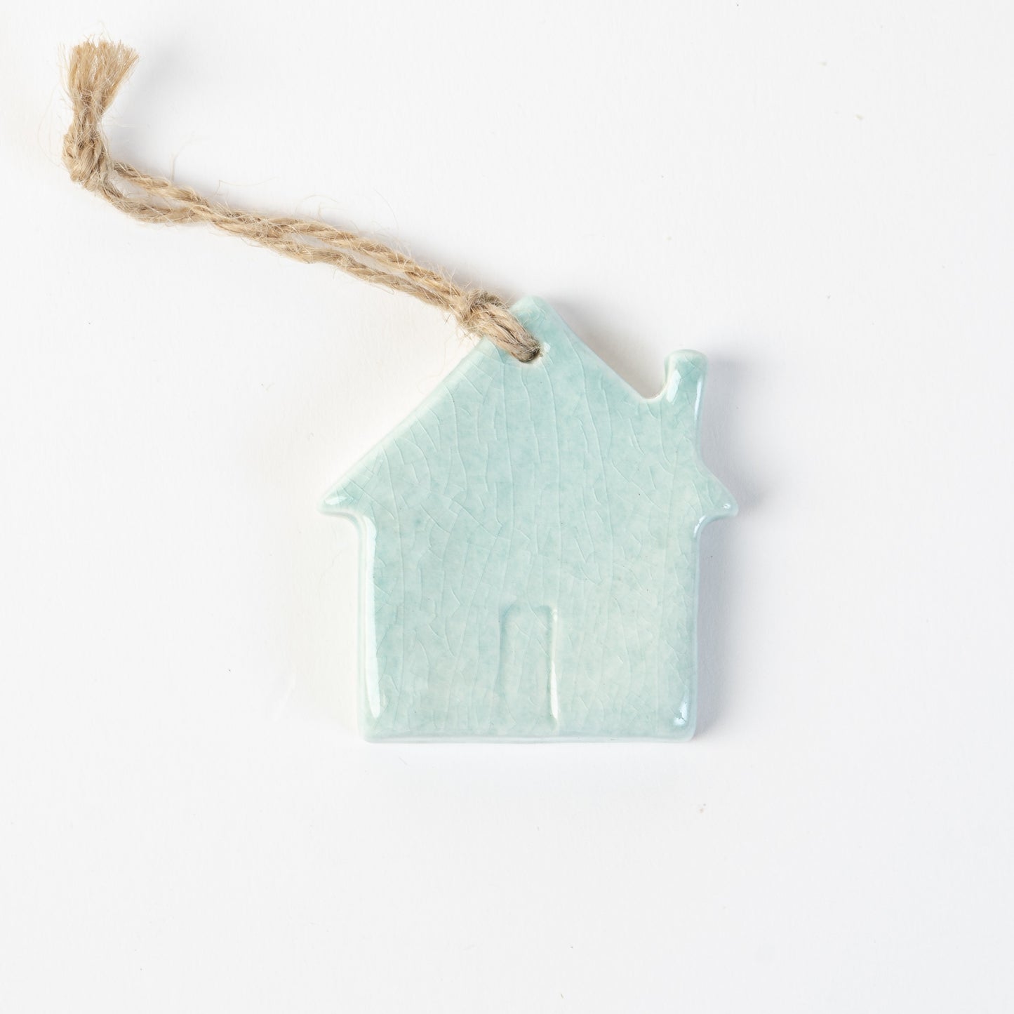 Arctic blue Ceramic house-shaped Christmas ornament made by the wirksworth pottery company.