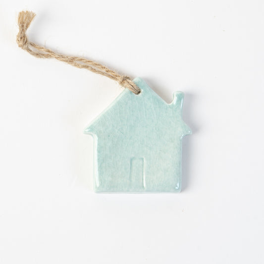 Arctic blue Ceramic house-shaped Christmas ornament made by the wirksworth pottery company.