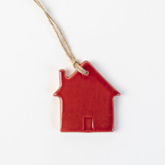 Candy cane red Ceramic house-shaped Christmas ornament made by the wirksworth pottery company.