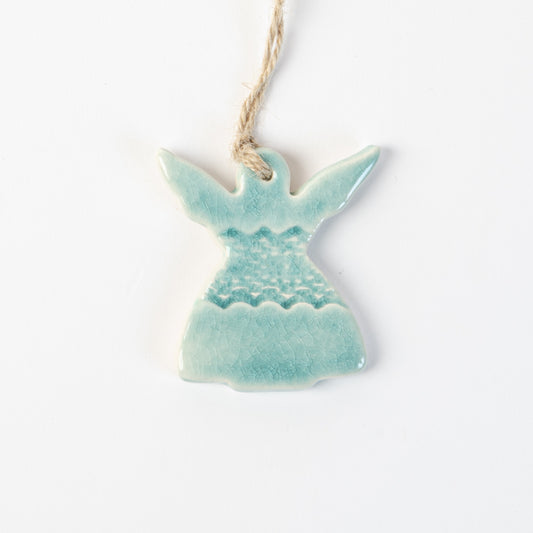 Ceramic angel in arctic blue ornament hanging on a white background made by the wirksworth pottery company