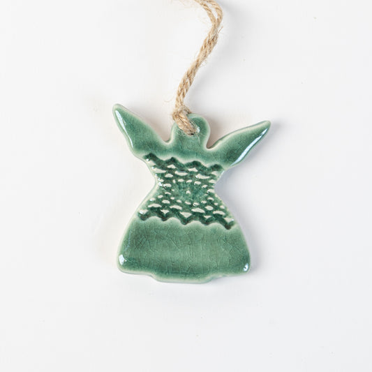 Ceramic angel in fir green ornament hanging on a white background made by the wirksworth pottery company