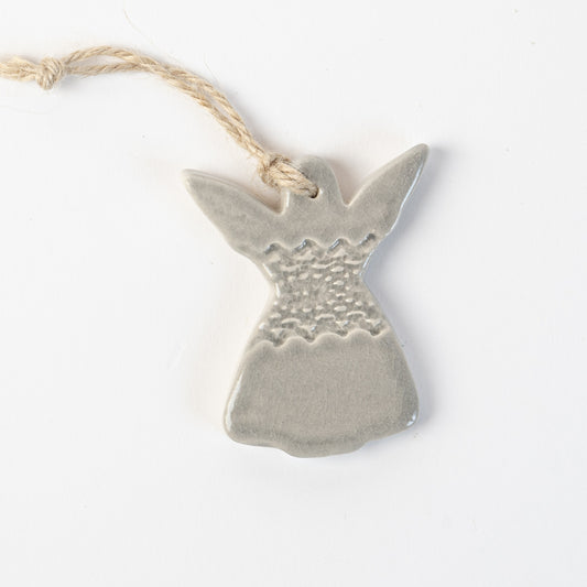 Ceramic angel in grey frost ornament hanging on a white background made by the wirksworth pottery company