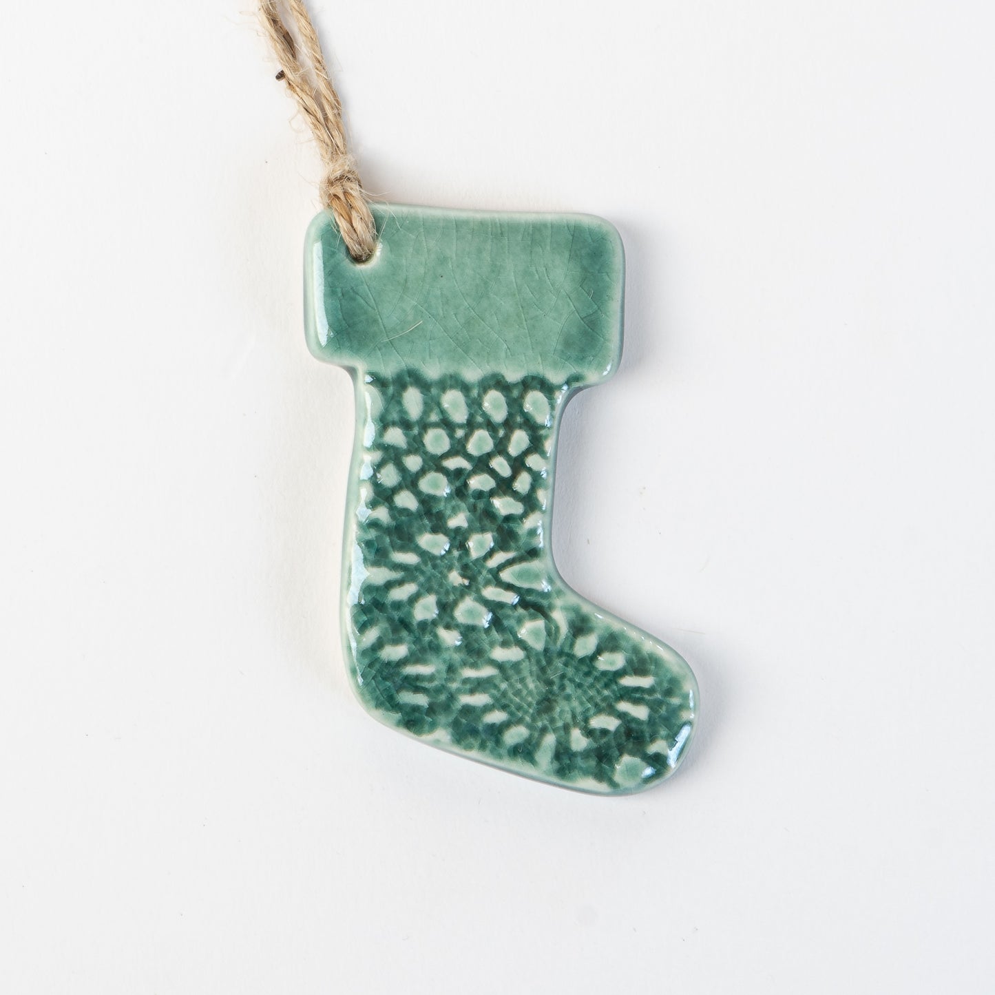 Fir Green handmade ceramic stocking christmas decoration handmade by the wirksworth pottery company 
