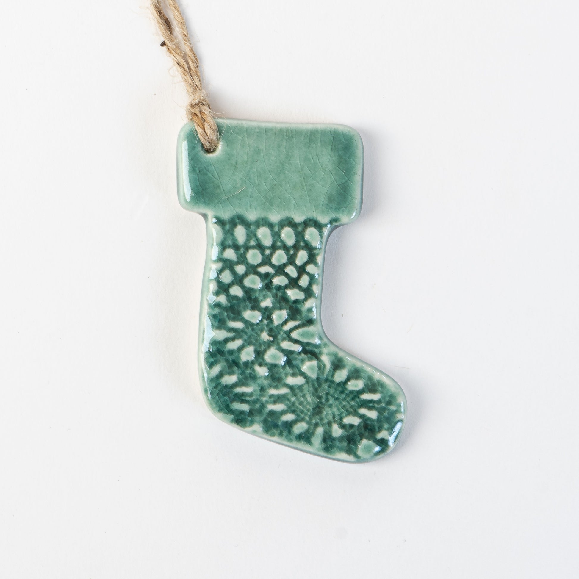 Fir Green handmade ceramic stocking christmas decoration handmade by the wirksworth pottery company 
