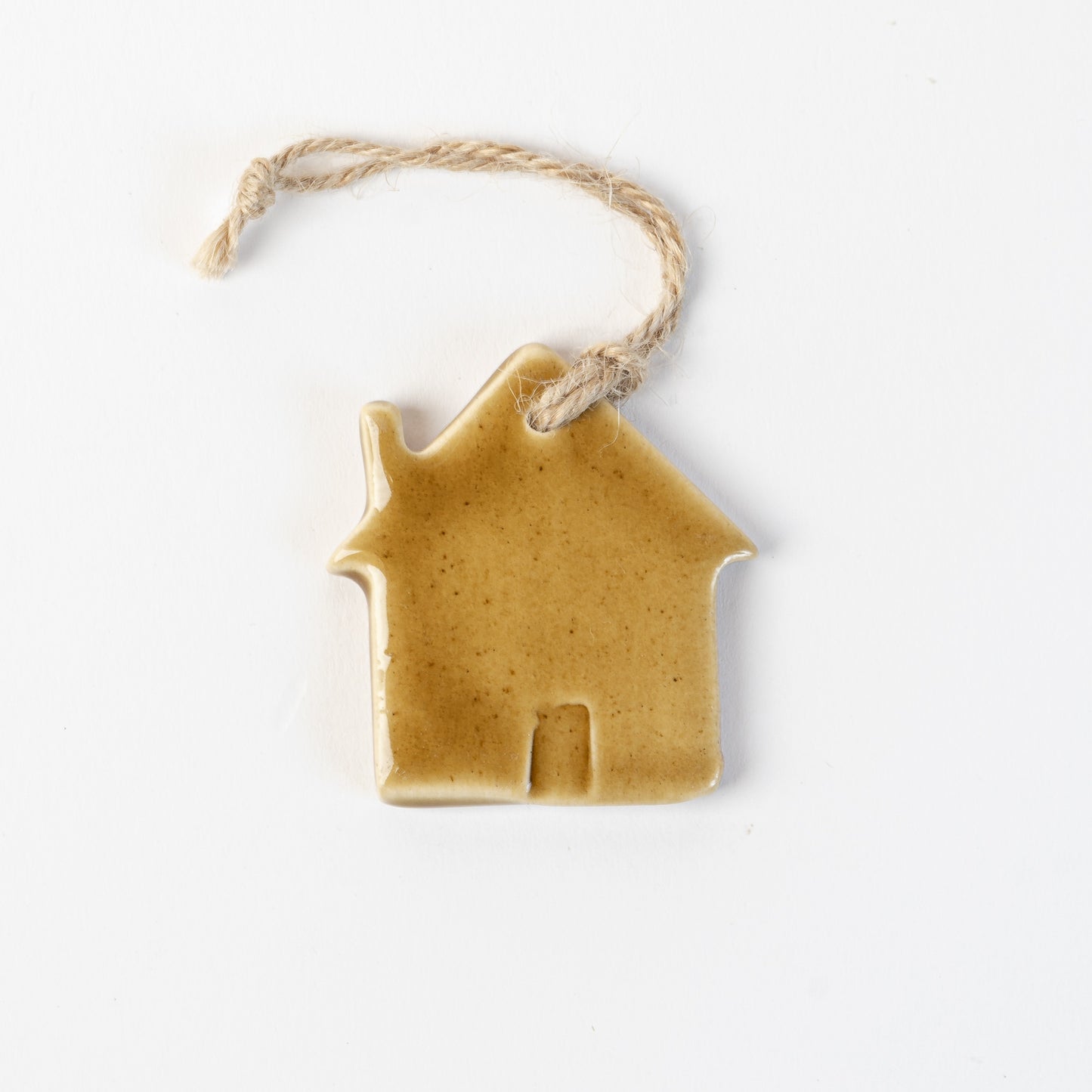 Golden Ceramic house-shaped Christmas ornament made by the wirksworth pottery company.