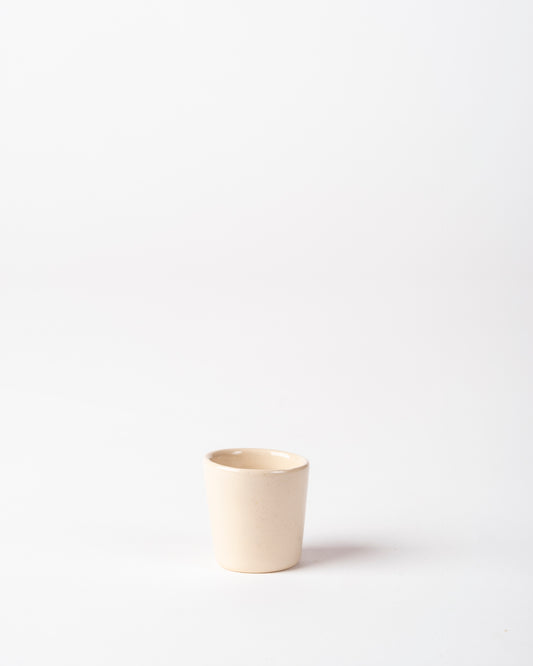 Handmade Creamy Off-white Tallow Ceramic Shot 'Glass', perfect for spirits, gifting and interiors.