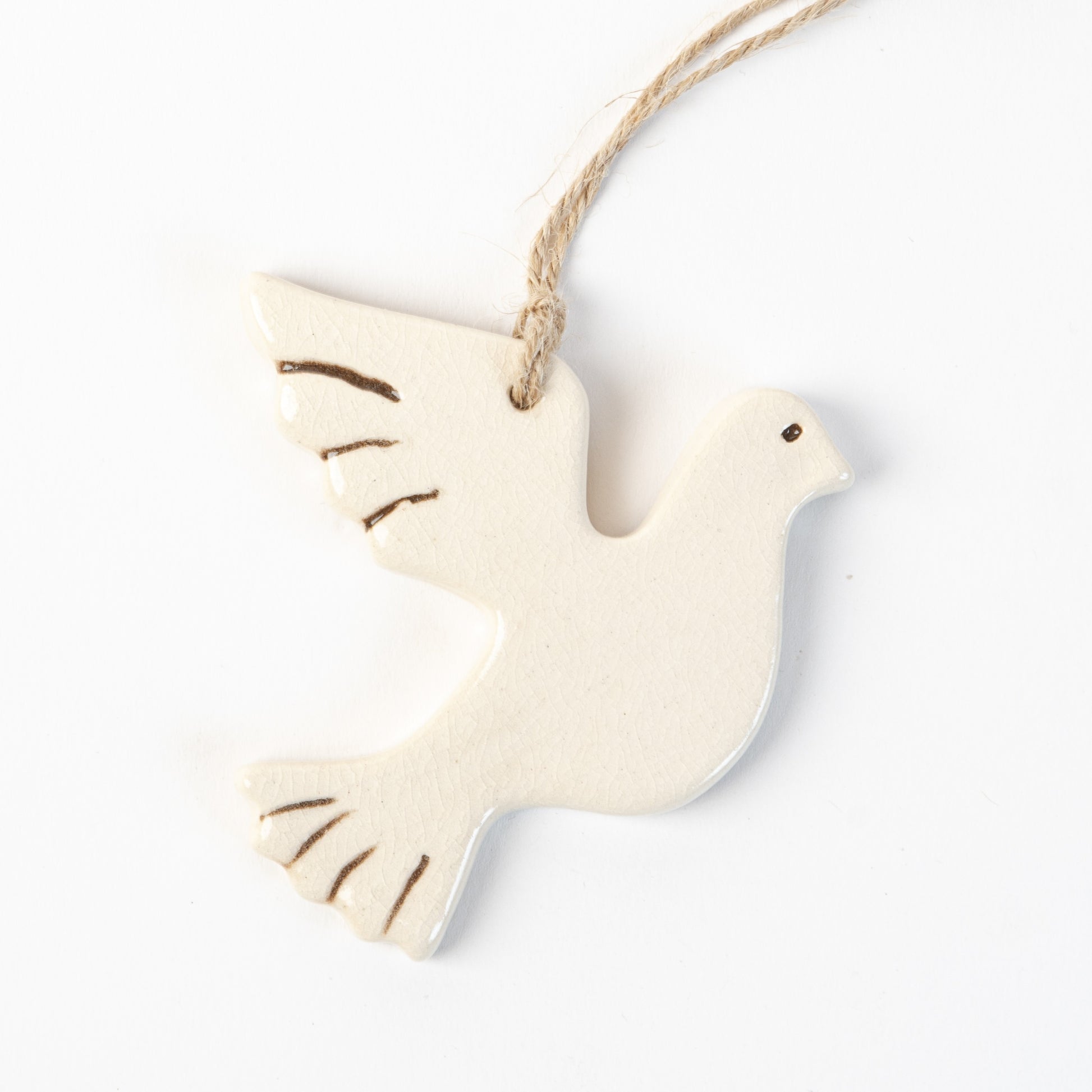 Ceramic White turtle dove ornament hanging on a white background