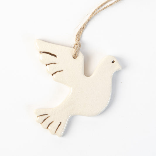 Ceramic White turtle dove ornament hanging on a white background