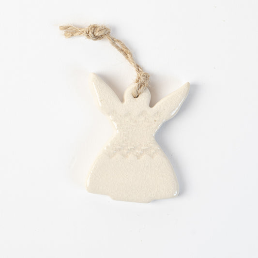 Ceramic angel in polar white ornament hanging on a white background made by the wirksworth pottery company