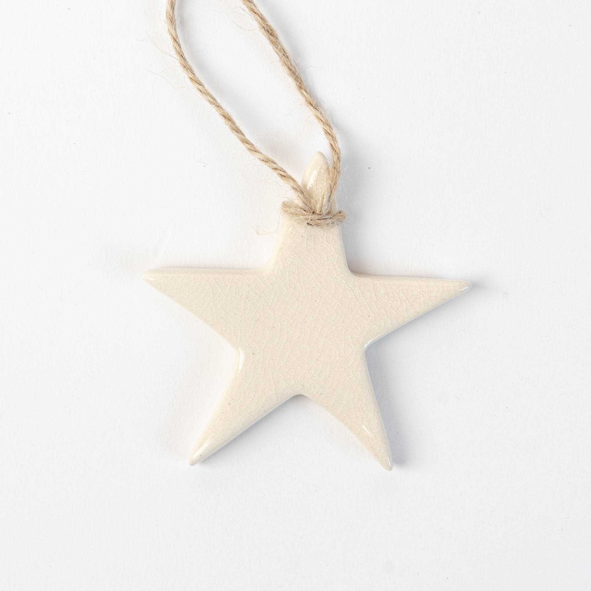 polar white Star-shaped ceramic ornament on a white background made by the wirksworth pottery company