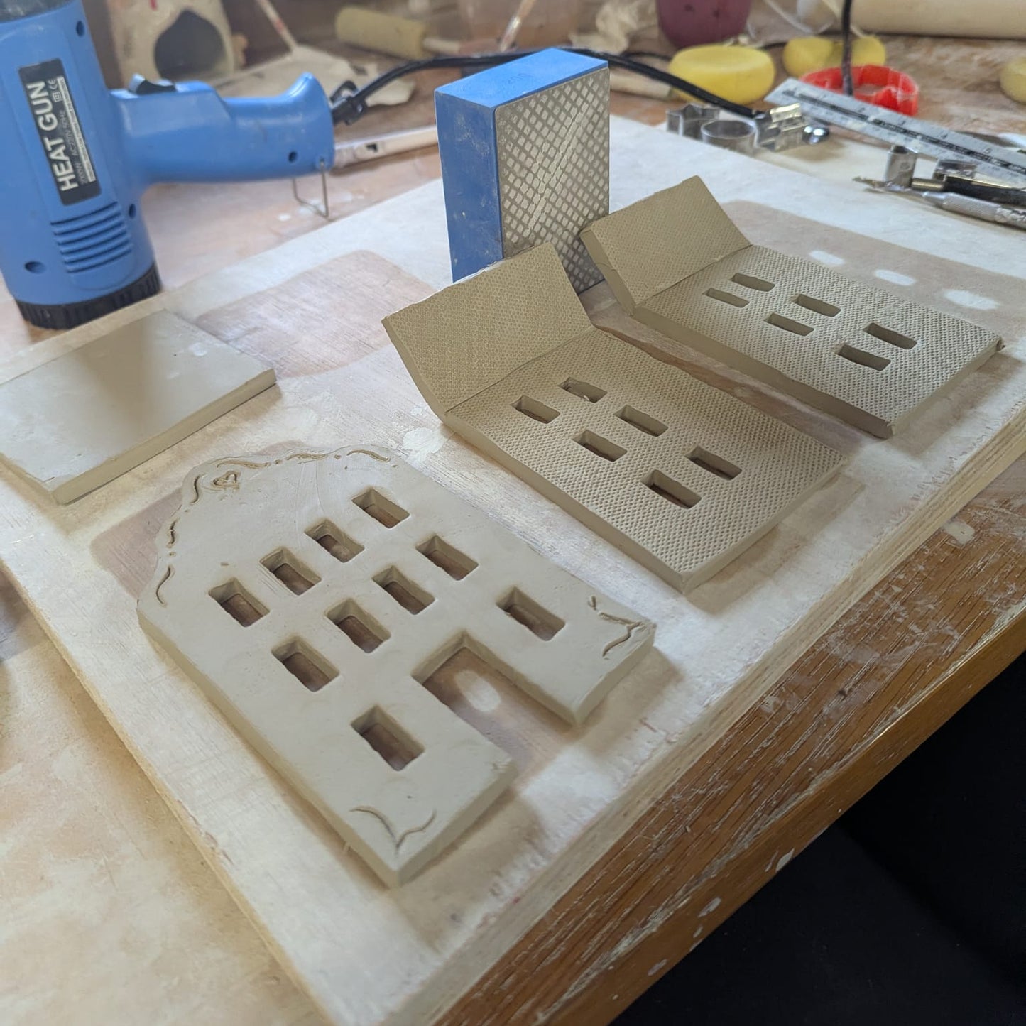Workbench with ceramic mold and tools in a workshop setting